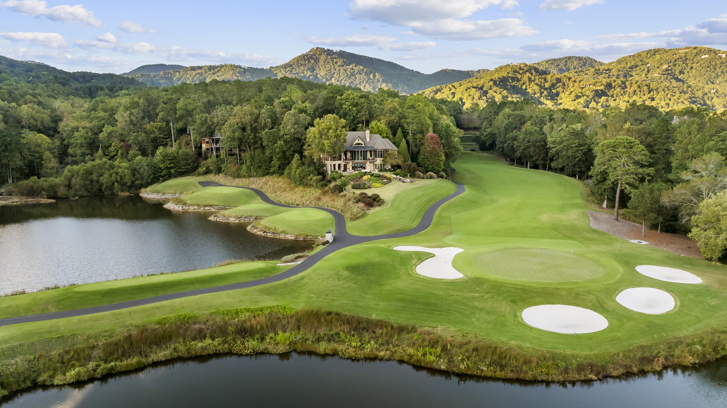 15 Water View Court on its peninsula above The Cliffs Valley golf course, Blue Ridge Mountains behind